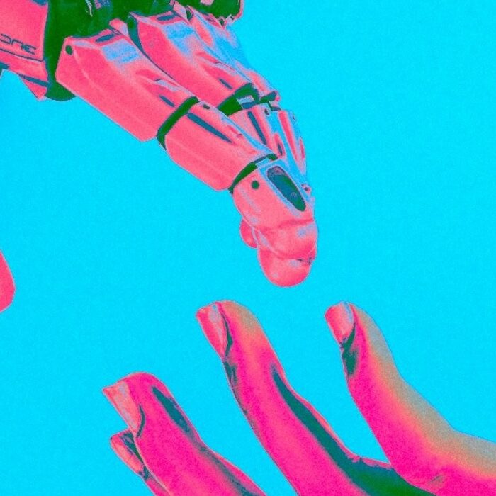 robot and human reaching hands